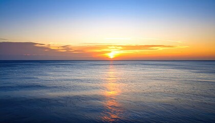 Obraz premium Calm Early Morning Beach Sunset With Seagulls And Glowing Sky