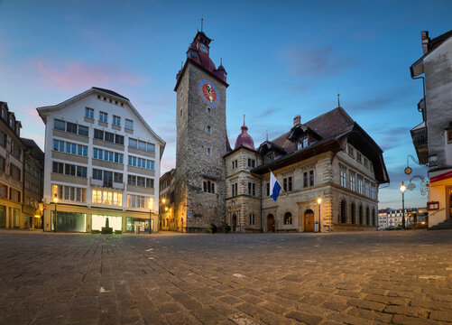 Lucerne, Switzerland. Wide angle view of Kornmarkt square at dusk with Renaissance-style town hall building constructed in  1602 - 1606