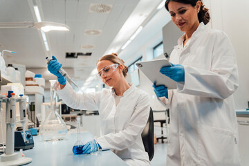 Scientists analyzing liquid samples in a modern laboratory