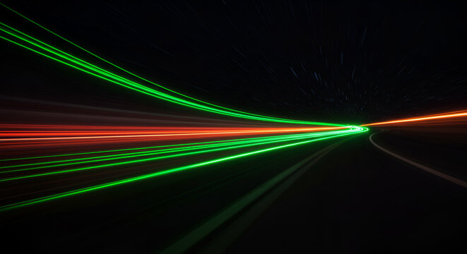 Abstract light trails on a road at night creating a sense of speed