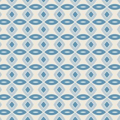 Obraz premium A seamless geometric pattern with horizontal rows of interlocking shapes including diamonds and ovals in shades of blue and cream