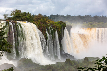 Iguazu Falls, waterfalls of Iguazu River on border of Argentine and Brazilian state of Parana. Panoramic view of magnificent natural wonder of the world. Brazil side. Brazilian wilderness landscape.