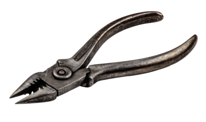 Aged metal pliers on a dark background