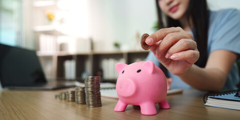 Saving Money: Young Woman with Piggy Bank and Coins