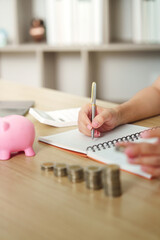 Financial Empowerment: Young Woman Saving Coins in Piggy Bank