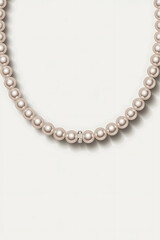 Elegant pearl necklace with a central accent, radiating classic sophistication and timeless beauty.