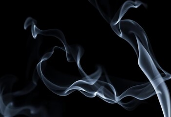 Wispy tendrils of grey smoke curl against a stark black background, fire, elegant