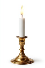 Single white candle in antique brass candlestick, isolated on white background