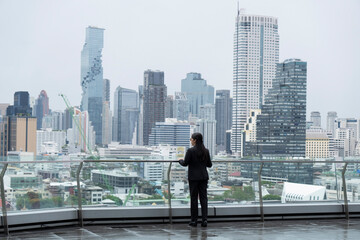 Asian business woman on the top roof