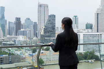 Asian business woman on the top roof
