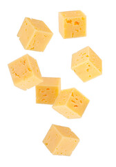 Cubes of regular cheese falling in space. Isolated on white.