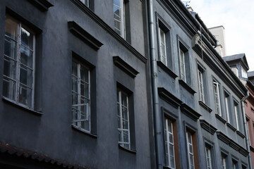 Moody European architecture: Row of aged, dark gray buildings