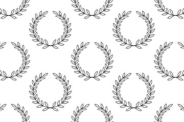 Obraz premium Seamless pattern of laurel wreaths in black outline on a white background repeated across the entire image