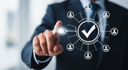 A businessman interacting with a digital interface displaying a checkmark and user icons around it