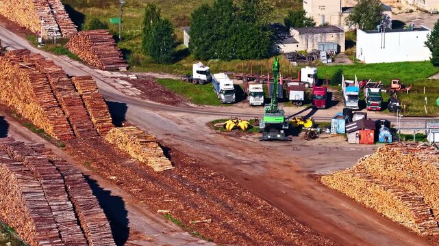 Long rows of timber arranged neatly for shipping, visible yard patterns and stacked textures