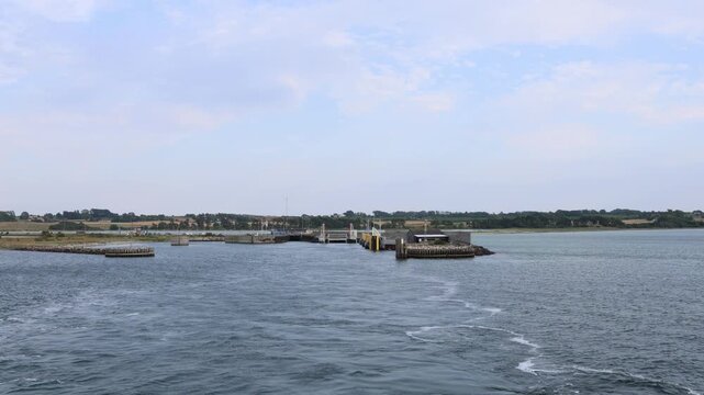 Leaving the coastline in Denmark, boad passing the coast