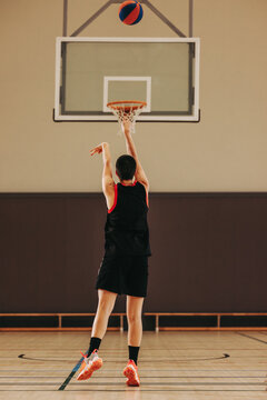 Perfect release: Female player sinks a three-pointer from the arc