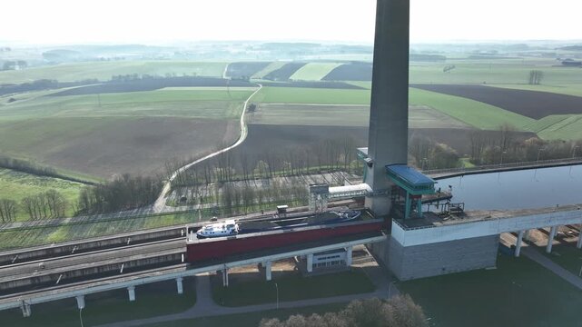 Drone semi orbit close aerial view of the Ronquieres ship lift in Belgium on a sunny clear day with detailed view of structure.