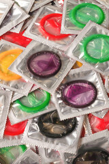 Colorful condoms background.