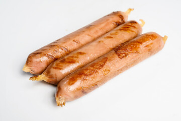 Fried grilled sausage isolated over a white background. Oktoberfest festival