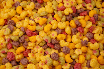 Sweet crunchy cornflakes as a background. Top view.