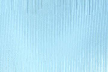 A light blue, frosted glass texture with vertical ribbed patterns creates a cool and serene abstract background