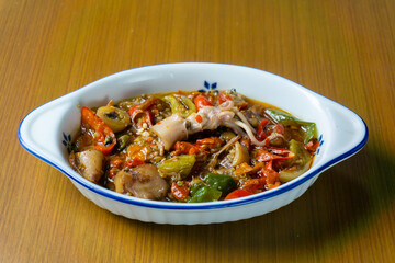 Cumi Asin Cabe Hijau, Salted Squid with Green Chili,  traditional Indonesian dish. Made from salted, dried squid that is stir-fried with green chilies, green tomatoes, and various spices. 