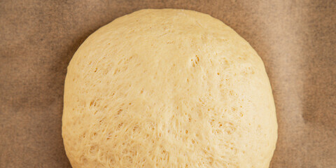 Dough raw cooking yeast, flour, water tasty snack fresh delicious gourmet food background on the table rustic food top view copy space