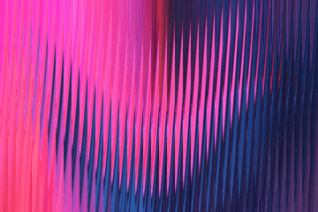 A vibrant abstract background features a dynamic interplay of pink and blue vertical lines with a textured, rippled effect, creating a sense of movement and depth