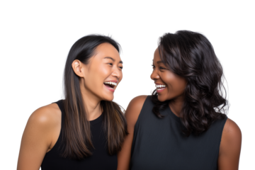 Two young women laughing together in conversation