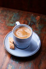 Cup of coffee on rustic wooden background. Soft focus. Copy space	
