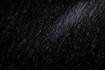 Illuminated heavy rain and snow falling diagonally at night