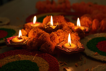 Diwali Festival. Traditional oil lamps and marigold flowers creating a festive ambiance.