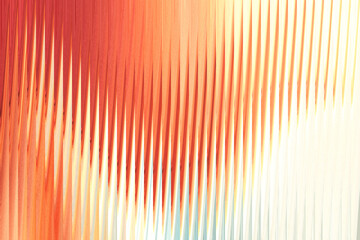 Abstract vertical lines of warm orange, red, and yellow hues blend and fade into a soft, bright background, creating a sense of movement and light