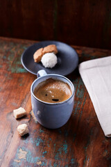 Cup of coffee on rustic wooden background. Soft focus. Copy space	