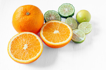 Citrus fruit of Halved orange fruit, slices lemon or lime fruit and Kaffir lime fruit on white background,
