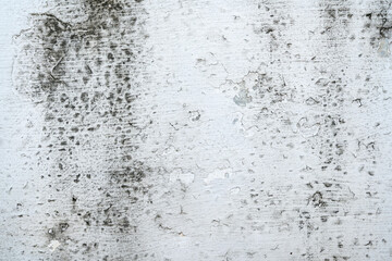 Grey cement concrete wall grunge background design. Abstract plaster textured with scratches and cracks for wallpaper or copy space
