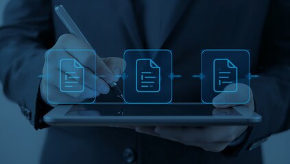Business professional using digital document workflow on tablet for efficient data management