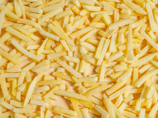 A close-up of golden French fries, perfectly crispy and ready to serve, ideal for fast food or snack themes