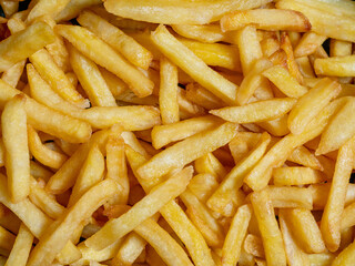 A vibrant display of golden French fries, showcasing their delicious texture and appealing color, perfect for food promotions