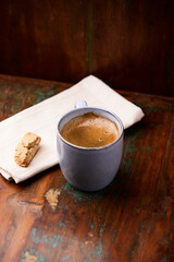 Cup of coffee on rustic wooden background. Soft focus. Copy space	