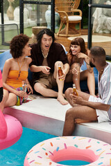 Stylish friends enjoy laughter and drinks at a vibrant summer pool party gathering