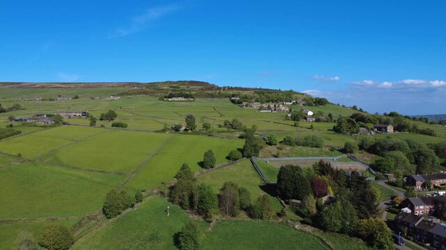 aerial scenic drone view of west yorkshire landscape with sandy gate road outside Hebden Bridge with Midgley moor in the distance