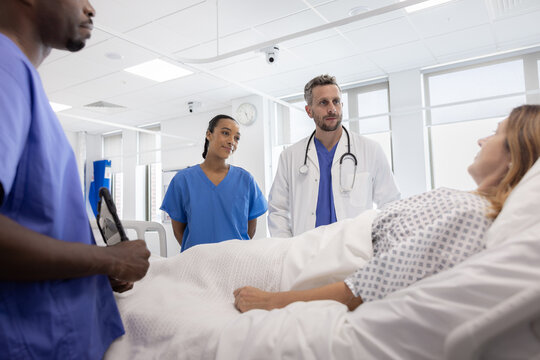 Healthcare Team giving patient results in a hospital ward
