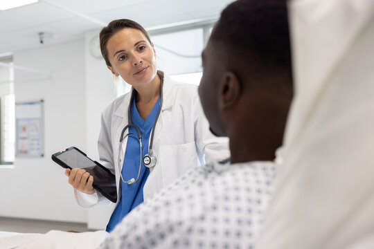Nurse Engaging with Patient in Hospital Room