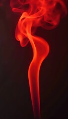 A close up of a red smoke on a black background.