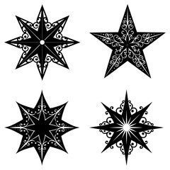 Obraz premium Four decorative black stars with varying points and ornate swirl designs on a white background image