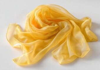 Soft, golden yellow sheer scarf draped on a white surface