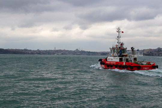 Istanbul - Turkey: 19 April 2022. Istanbul Coastal Safety boat. A cloudy evening in Bosporus