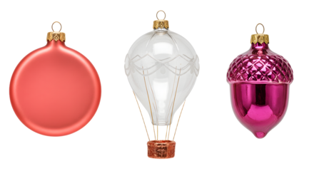 Set of colorful Christmas ornaments including red bauble, white hot air balloon-shaped decoration, and pink acorn, perfect for festive holiday decor